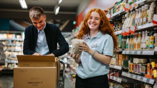 Young Worker - Male AndFemale Stocking Store Shelves